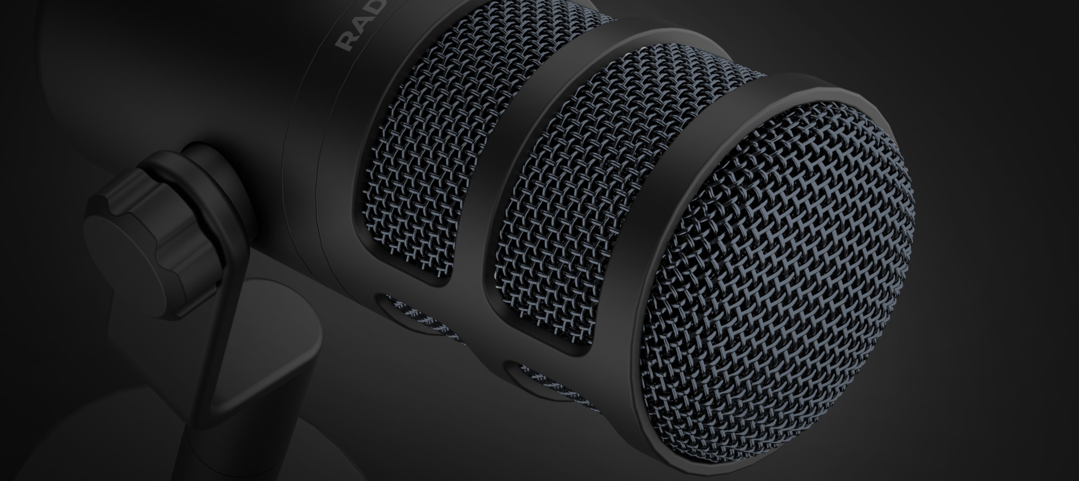 Gros plan sur le microphone dynamique USB Genesis Radium 350D, doté d'une finition noire et d'une grille en maille texturée.