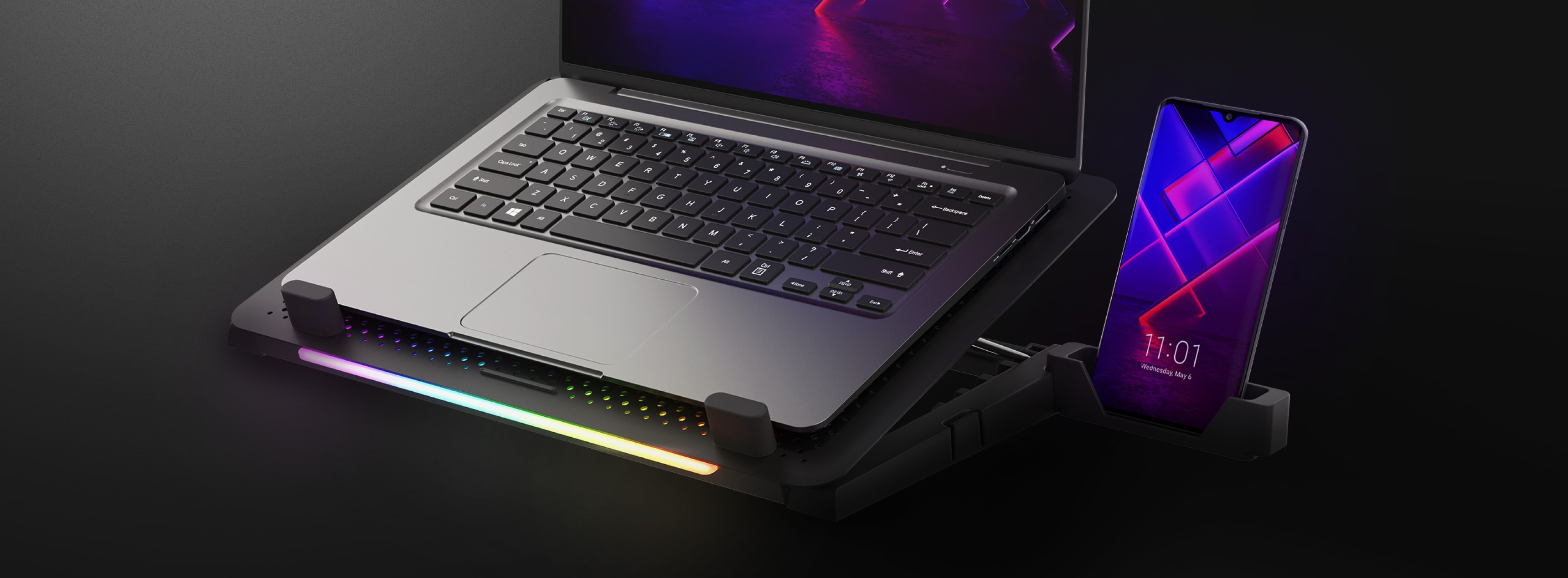 Support refroidissant pour ordinateur portable Genesis Oxid 450 avec éclairage RVB, ventilateur et deux ports USB, présentant un ordinateur portable et un smartphone.