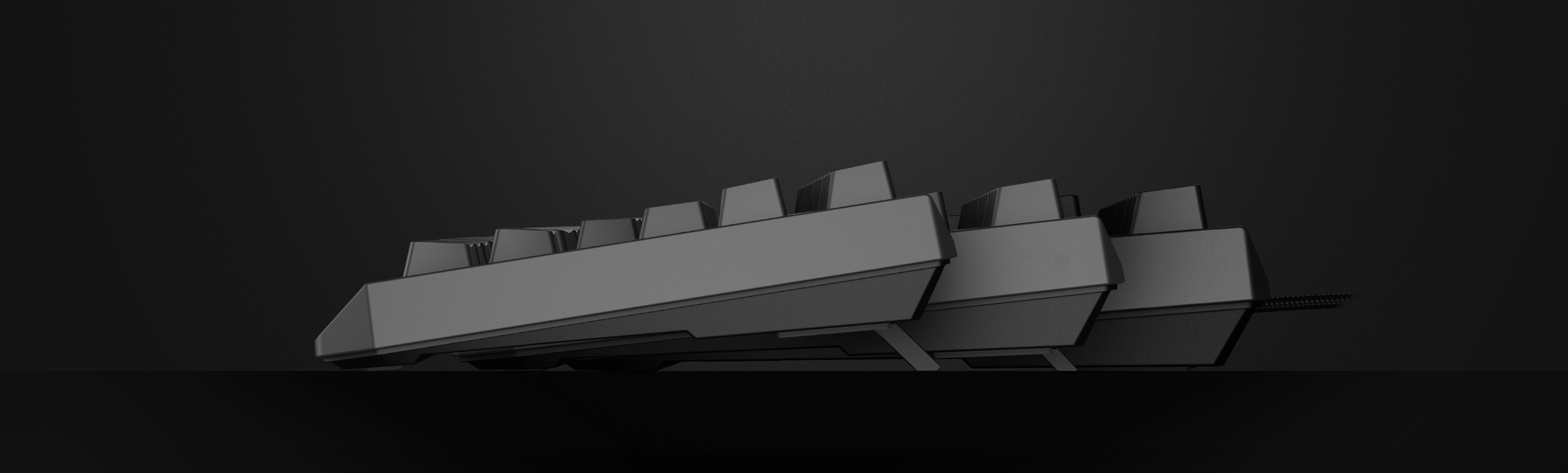 Un clavier de jeu mécanique noir présenté de côté, doté de commutateurs Outemu Red et d'une disposition TKL compacte.