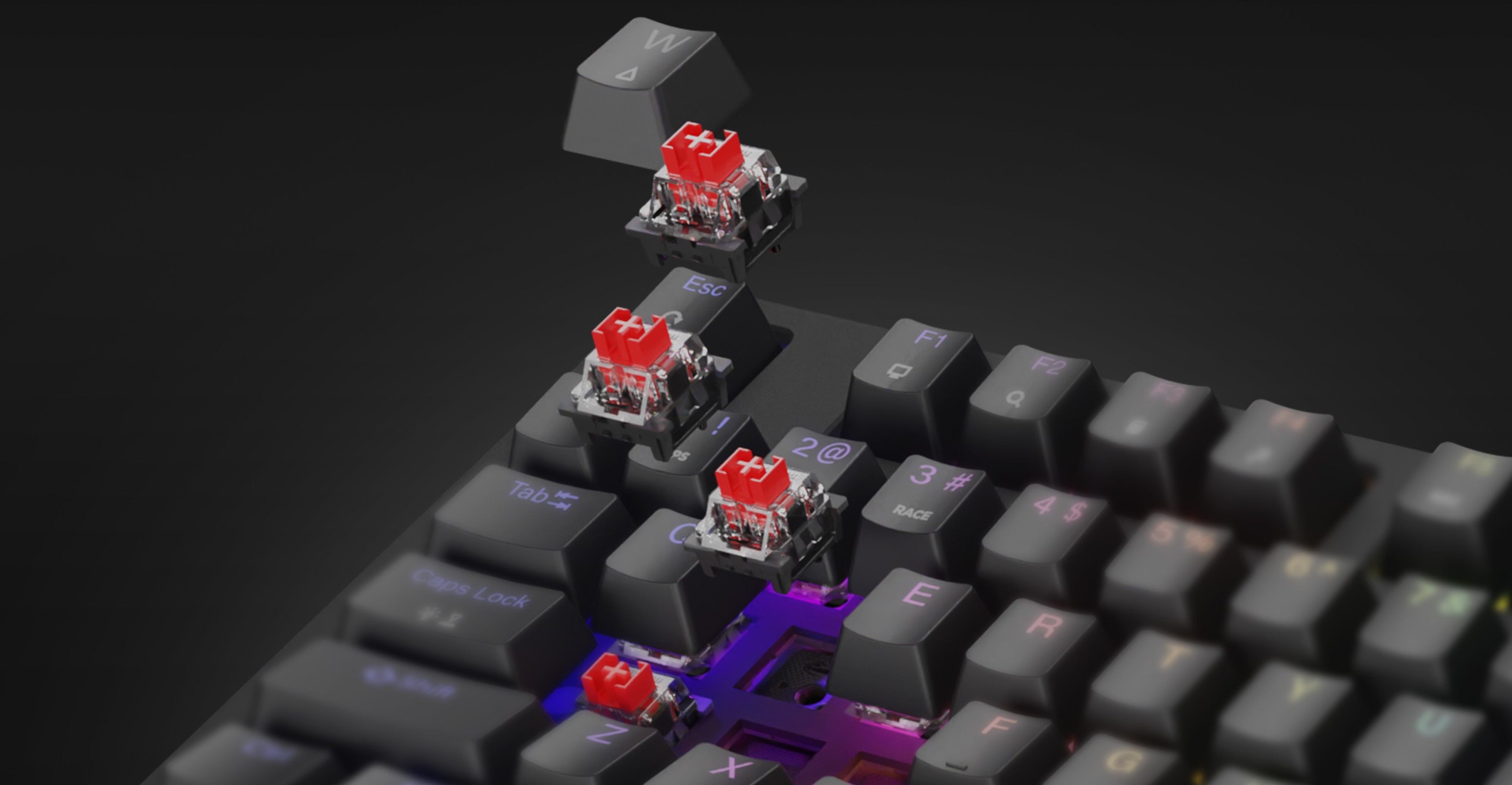 Clavier de jeu mécanique avec commutateurs rouges et éclairage RVB arc-en-ciel, mettant en valeur les claviers et commutateurs remplaçables à chaud.